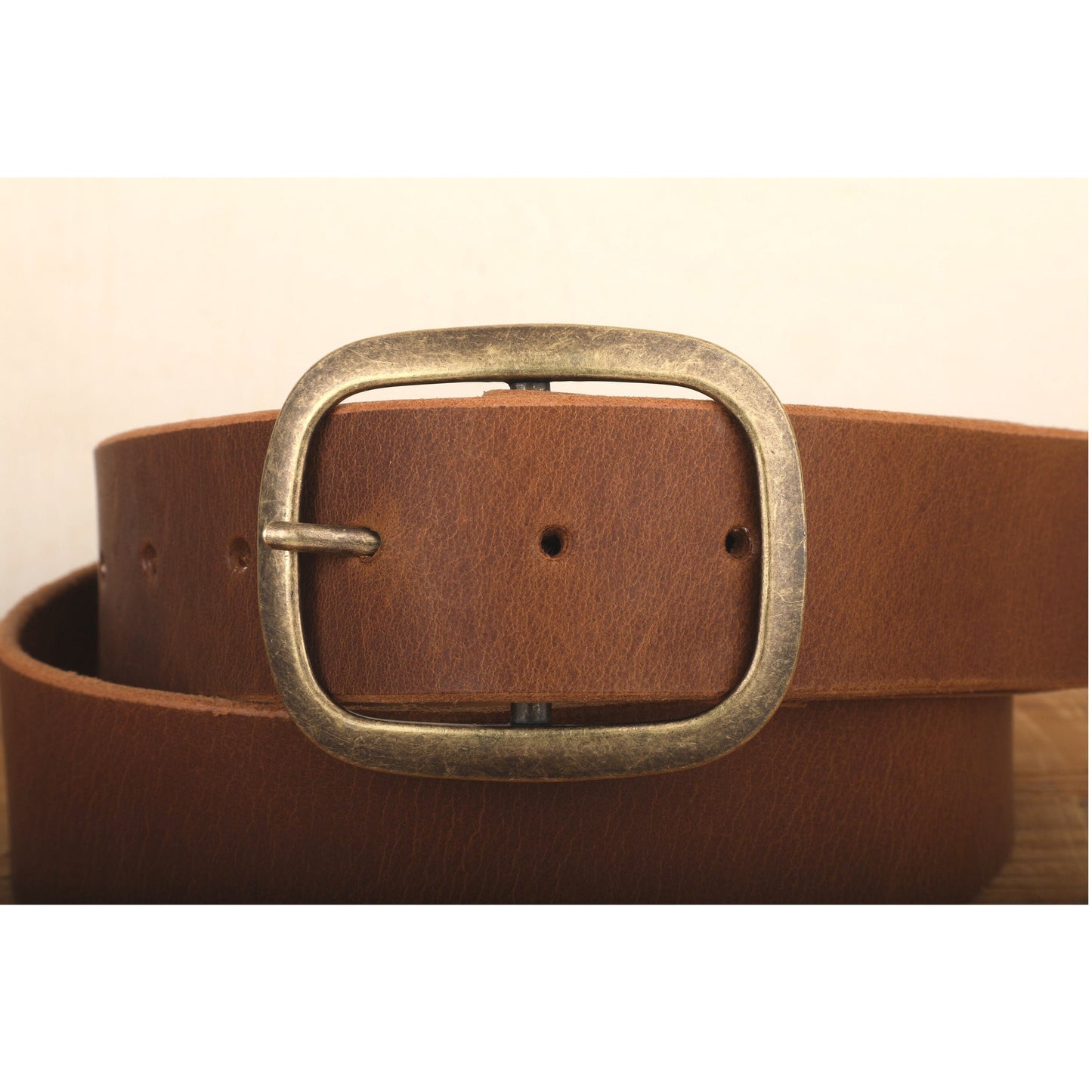 a brown leather belt with a metal buckle