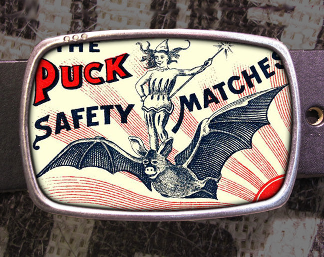 a belt buckle with a picture of a bat on it