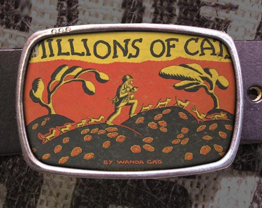 a belt buckle with a picture of a man on a hill