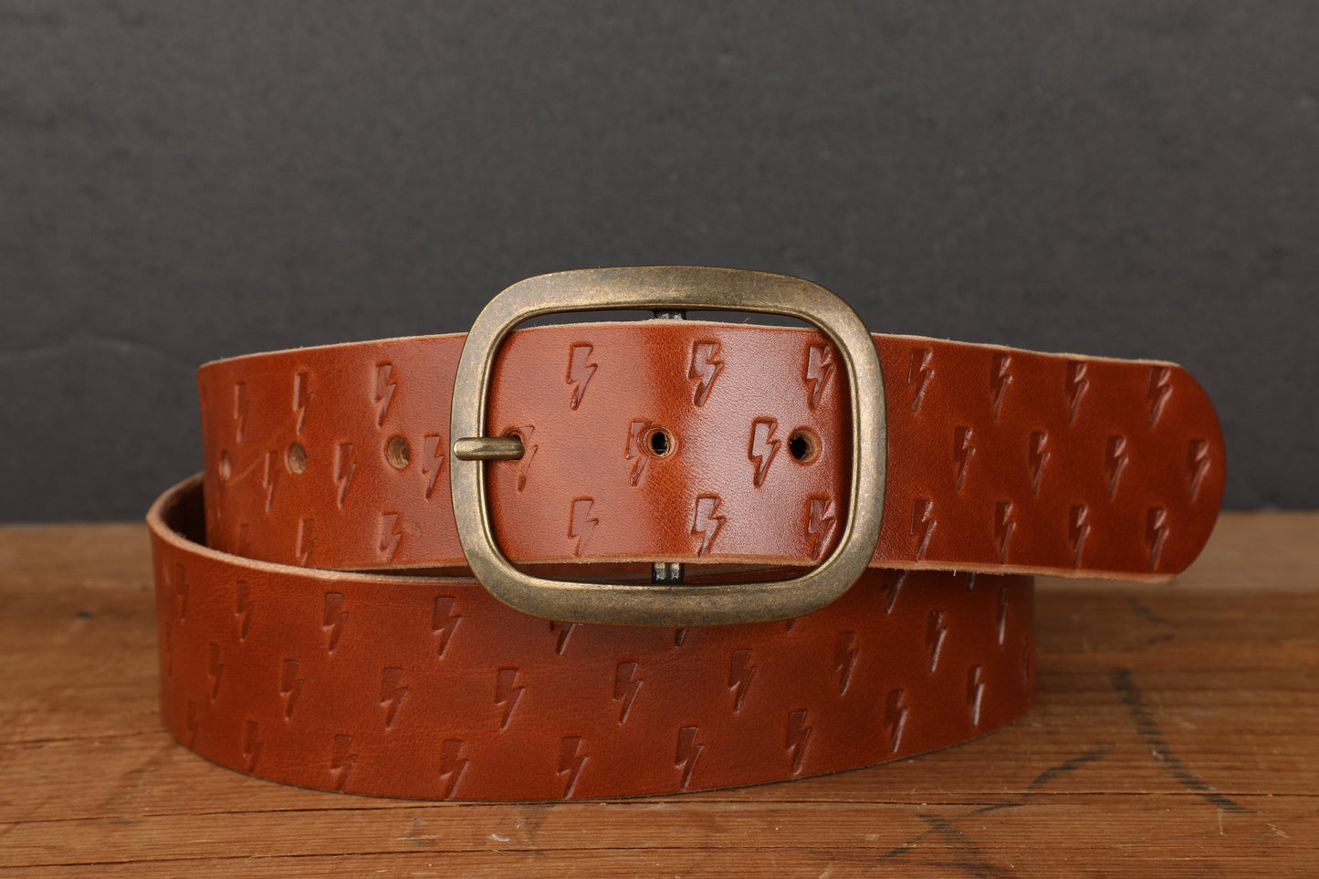 Medium Brown Bridle Leather Belt with Embossed Lightning Bolts and Antique Brass Buckle